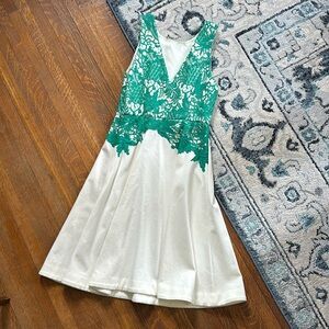 White sleeveless dress with green lace detail by Anthropologie